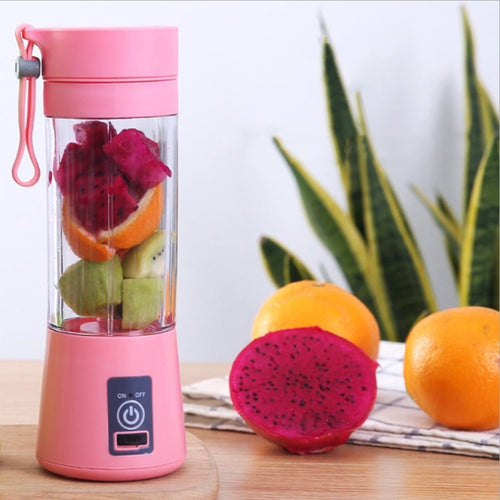 Pink portable fruit juicer or blender 